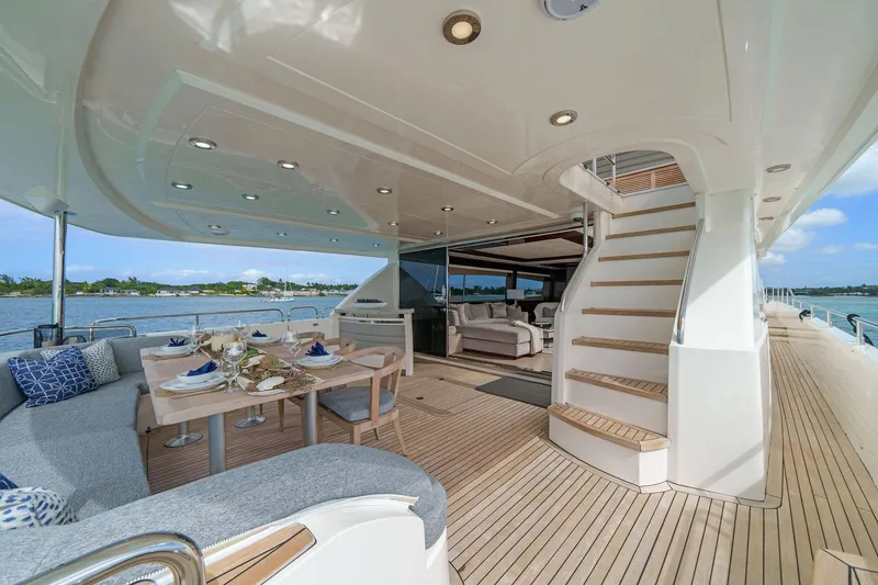 Slide: The Image of Luxurious 2011 Princess 95 yacht deck with elegant dining setup overlooking the ocean. - 22