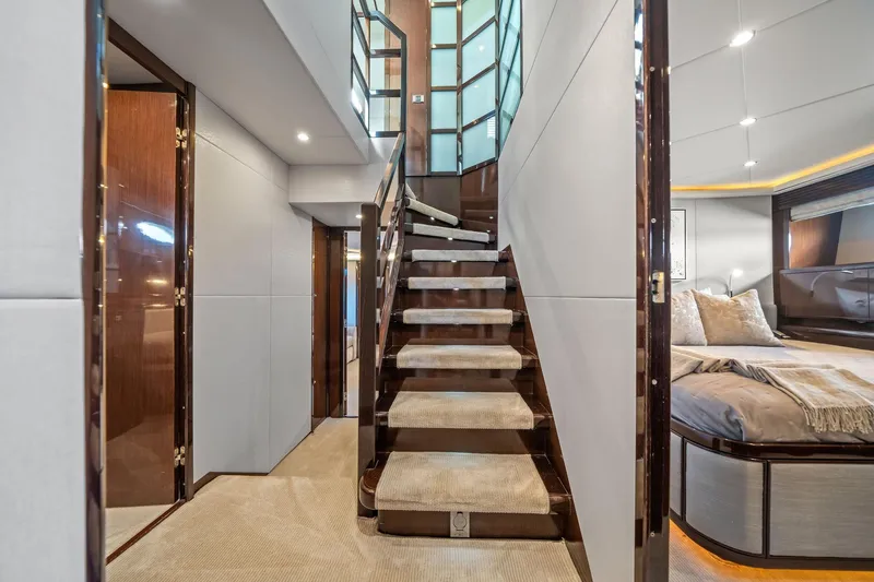 Slide: The Image of Luxurious bedroom interior on a 2011 Princess 95 yacht, featuring elegant wood finishes and modern design. - 36