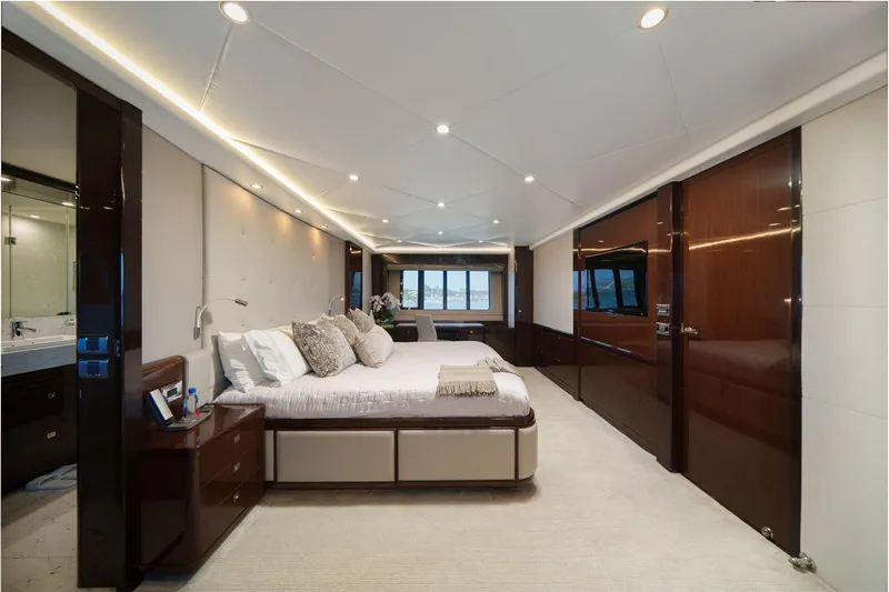 Slide: The Image of Luxurious yacht bathroom with marble countertops, wooden accents, and modern fixtures on a 2011 Princess 95. - 38