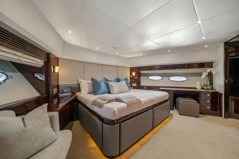 Slide: The Image of Luxurious yacht bathroom with marble sink, wooden cabinetry, and modern fixtures on a 2011 Princess 95. - 43