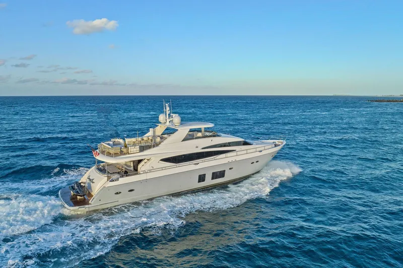 Slide: The Image of Luxurious 2011 Princess 95 yacht with slide, anchored in serene waters at sunset. - 8