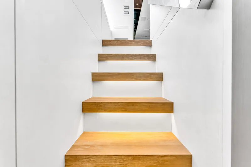 Slide: The Image of Wooden steps on a 2018 Sanlorenzo SL78 yacht interior staircase. - 27