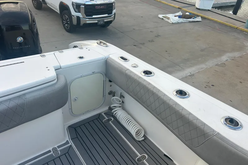 Slide: The Image of 2007 Fountain 38 Sportfish Cruiser OB interior with seating and rod holders. - 11