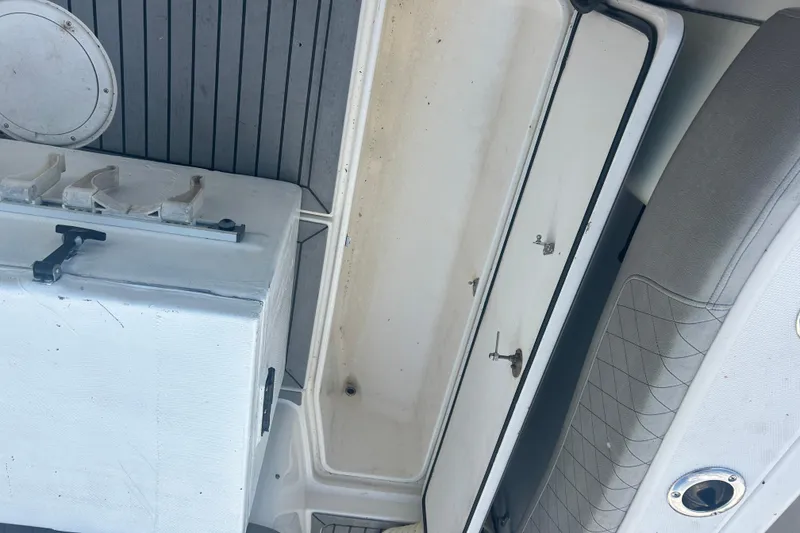 Slide: The Image of 2007 Fountain 38 Sportfish Cruiser OB interior with storage compartments and seating. - 13