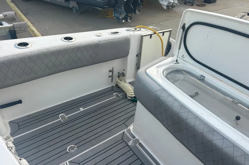 Slide: The Image of 2007 Fountain 38 Sportfish Cruiser OB interior with cushioned seating and storage compartments. - 15
