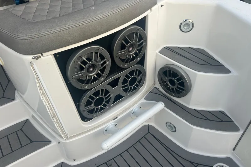 Slide: The Image of 2007 Fountain 38 Sportfish Cruiser OB with marine speakers and cushioned seating. - 18