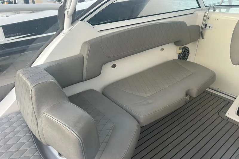 Slide: The Image of 2007 Fountain 38 Sportfish Cruiser OB interior with gray cushioned seating and sleek design. - 21