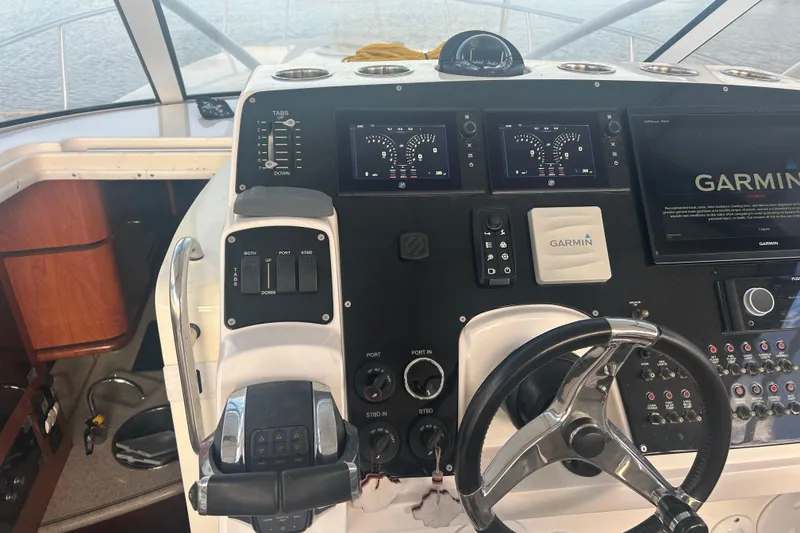 Slide: The Image of 2007 Fountain 38 Sportfish Cruiser OB helm with Garmin navigation system and controls. - 22