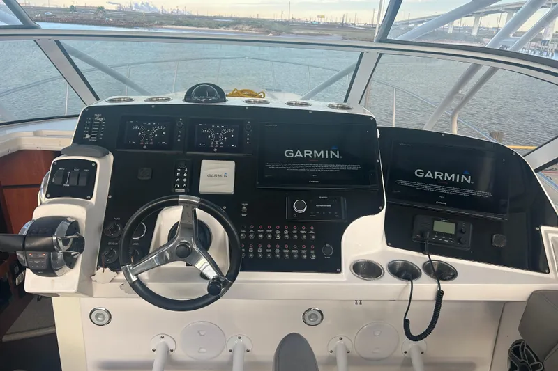 Slide: The Image of Helm of 2007 Fountain 38 Sportfish Cruiser OB with Garmin navigation displays. - 23