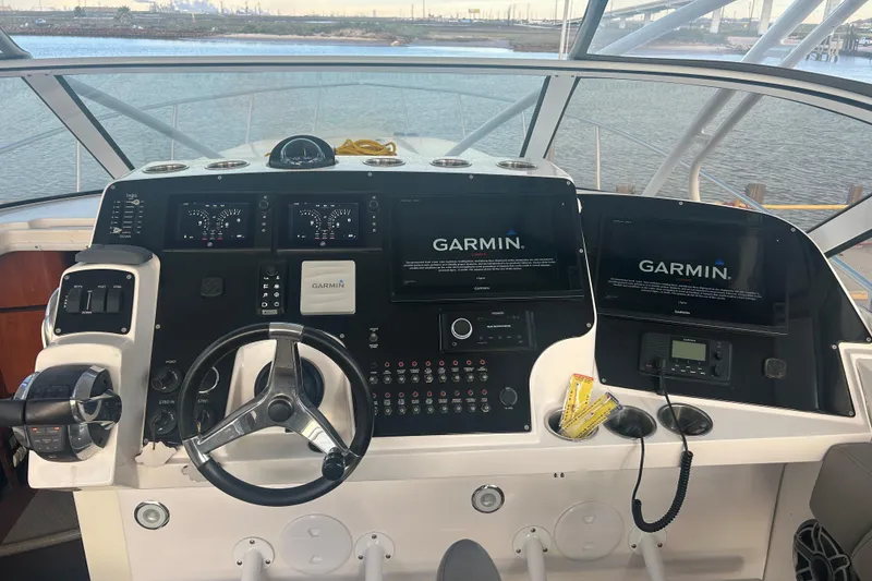 Slide: The Image of 2007 Fountain 38 Sportfish Cruiser OB helm with Garmin navigation displays. - 24