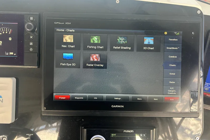 Slide: The Image of Garmin GPS display on 2007 Fountain 38 Sportfish Cruiser OB, showing navigation and radar options. - 25