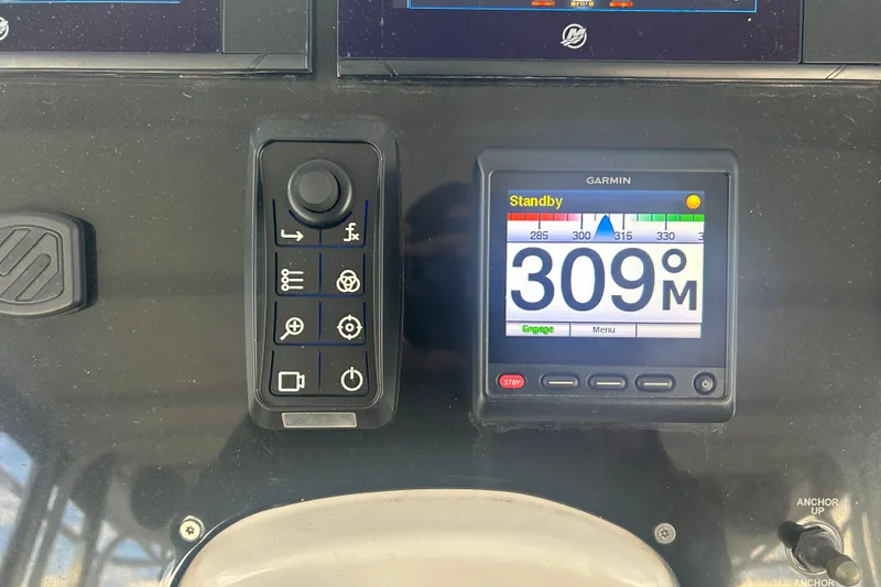 Slide: The Image of Control panel of a 2007 Fountain 38 Sportfish Cruiser OB with Garmin display showing 309M. - 30