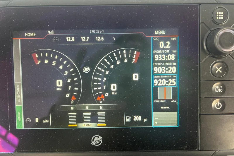 Slide: The Image of Dashboard of a 2007 Fountain 38 Sportfish Cruiser OB showing engine metrics and controls. - 31