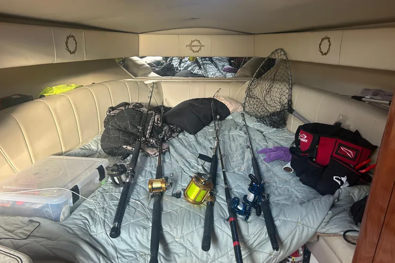 Slide: The Image of Interior of 2007 Fountain 38 Sportfish Cruiser with fishing gear and rods. - 35