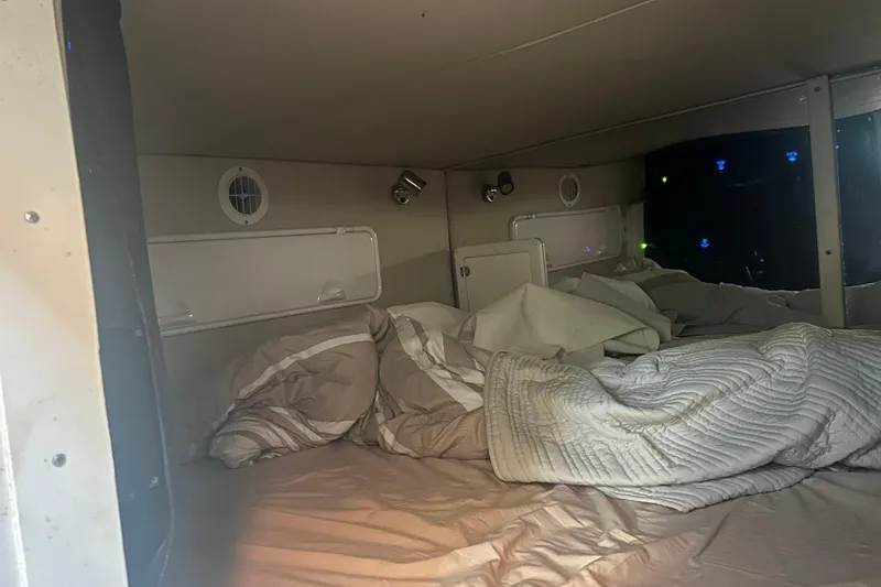 Slide: The Image of Interior cabin of 2007 Fountain 38 Sportfish Cruiser OB with bedding and lighting. - 36