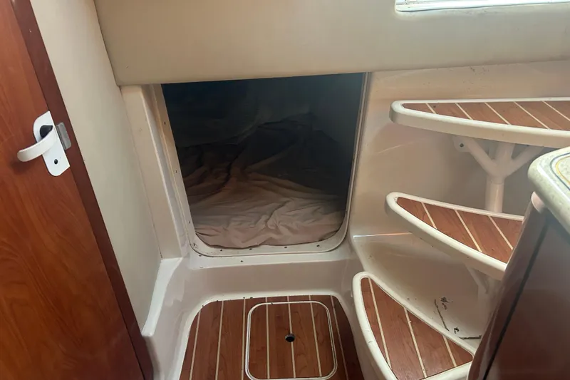 Slide: The Image of Interior cabin view of 2007 Fountain 38 Sportfish Cruiser OB with wooden steps. - 37