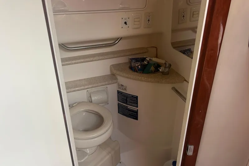 Slide: The Image of 2007 Fountain 38 Sportfish Cruiser OB bathroom with toilet and sink. - 38