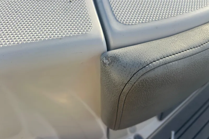 Slide: The Image of Close-up of 2007 Fountain 38 Sportfish Cruiser OB seat with textured and cracked upholstery. - 49
