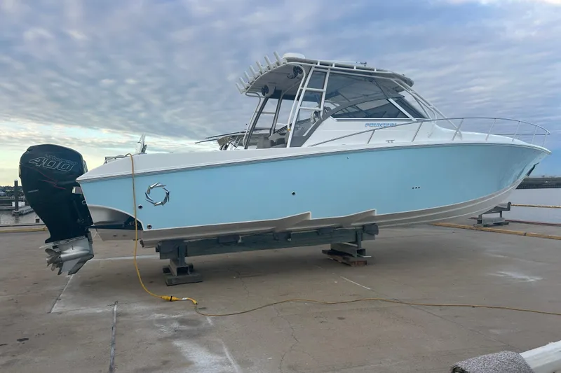 Slide: The Image of 2007 Fountain 38 Sportfish Cruiser OB on a dock. - 5