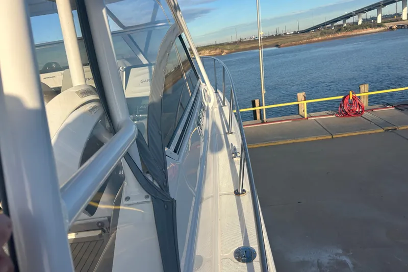 Slide: The Image of 2007 Fountain 38 Sportfish Cruiser OB docked by the water, showcasing sleek design. - 53