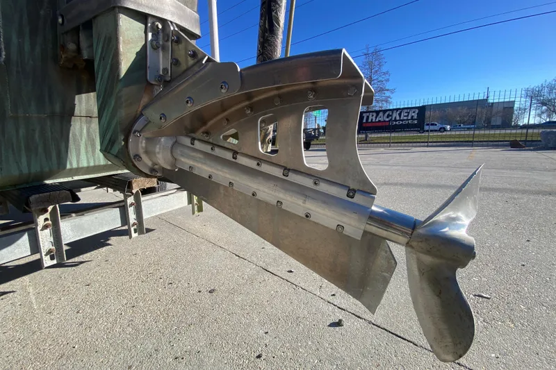 Slide: The Image of Close-up of a 2015 Gator Tail 18' boat propeller in a parking lot. - 10