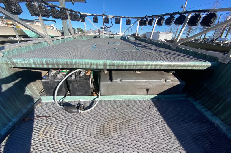 Slide: The Image of 2015 Gator Tail 18' boat deck with storage and battery compartments. - 17