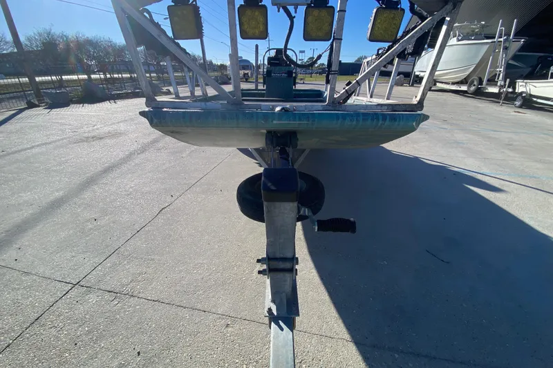 Slide: The Image of 2015 Gator Tail 18' boat on trailer in outdoor setting. - 9