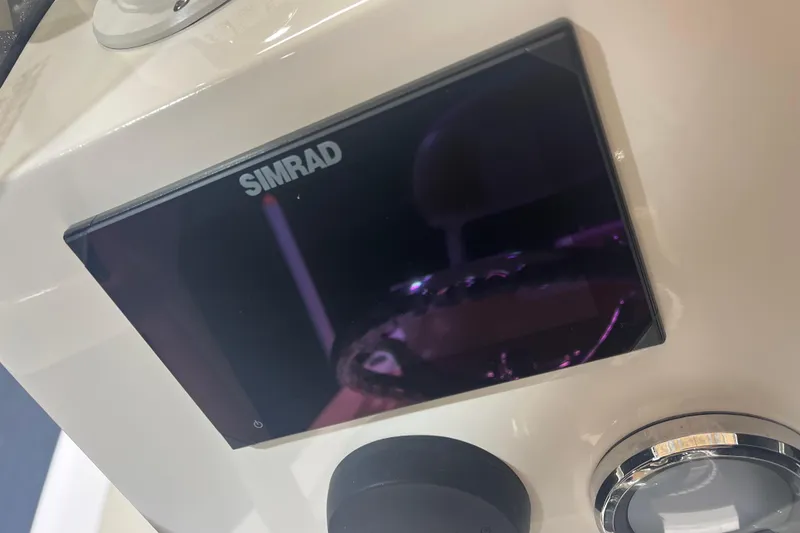 Slide: The Image of Simrad display on 2023 NauticStar 227 XTS boat dashboard. - 11