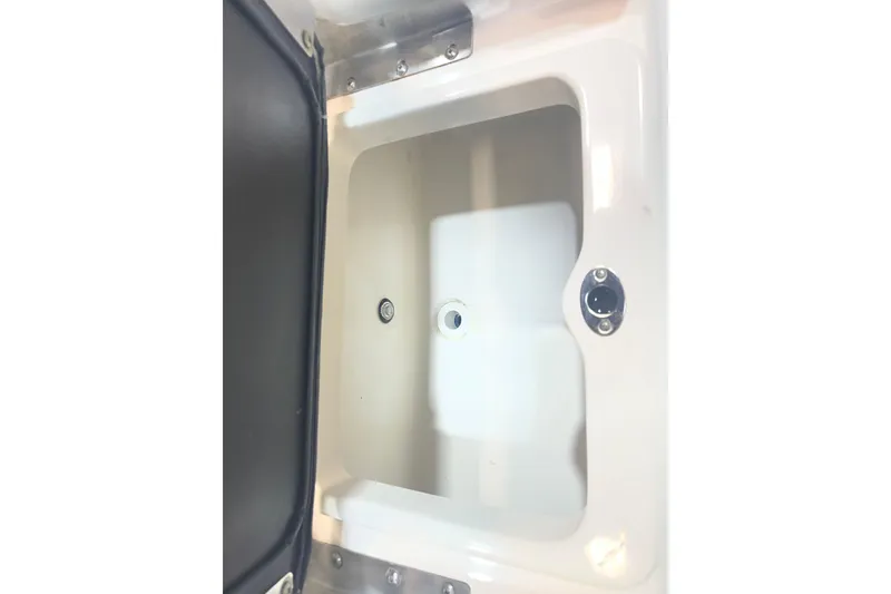Slide: The Image of 2023 NauticStar 227 XTS boat storage compartment, open and empty. - 13