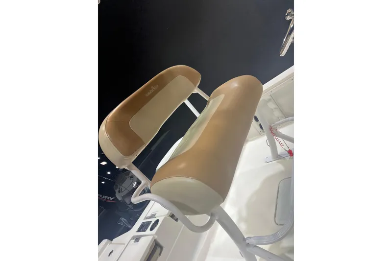 Slide: The Image of 2023 NauticStar 227 XTS boat seat with tan and white upholstery. - 6