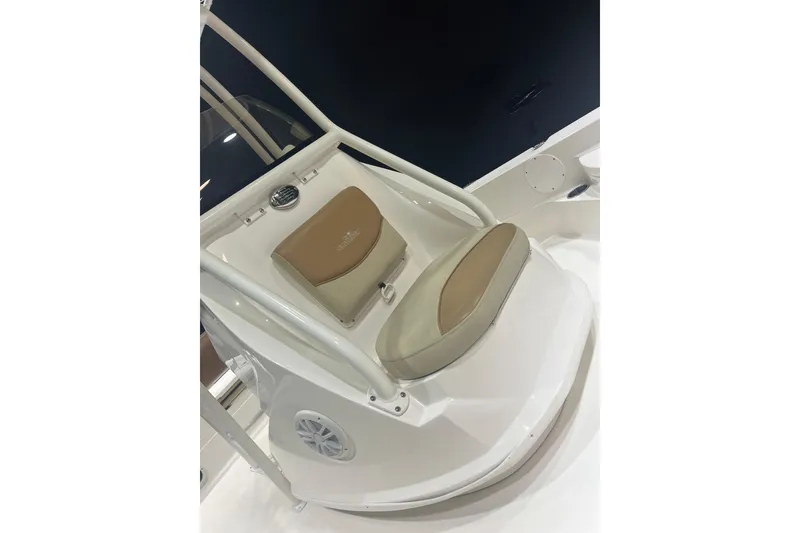 Slide: The Image of 2023 NauticStar 227 XTS boat seat with beige cushion and white frame. - 7