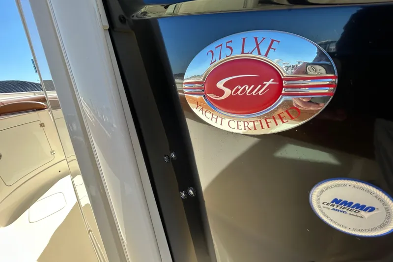 Slide: The Image of 2016 Scout 275 LXF yacht certification badge on boat exterior. - 11
