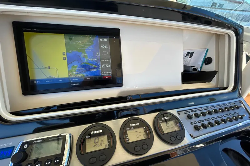 Slide: The Image of Dashboard of a 2016 Scout 275 LXF boat with Garmin navigation system. - 27