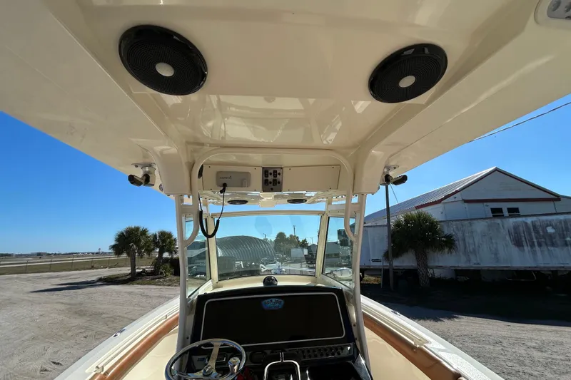 Slide: The Image of 2016 Scout 275 LXF boat interior with steering wheel and electronics. - 29