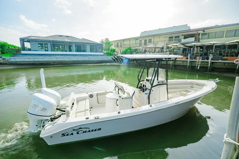 The Image of 2022 Sea Chaser 24 HFC boat docked near waterfront buildings. - 0