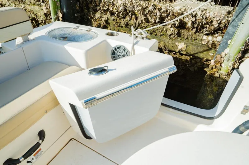 Slide: The Image of 2022 Sea Chaser 24 HFC boat interior with seating and storage compartment. - 16