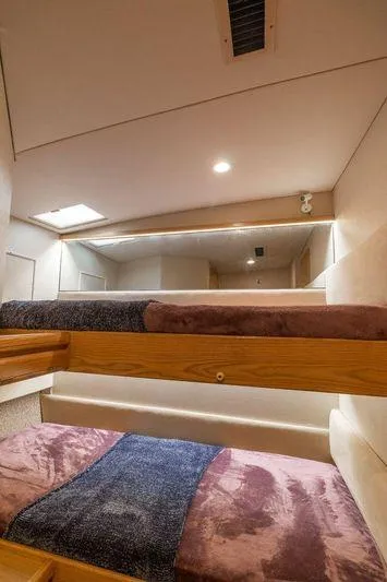 Slide: The Image of Interior of 1992 Huckins 70 Convertible yacht with cozy bunk beds. - 17