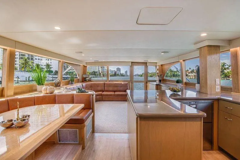 Slide: The Image of Luxurious interior of a 1992 Huckins 70 Convertible yacht with elegant wood finishes. - 6