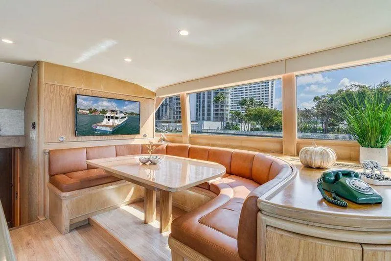 Slide: The Image of Luxurious interior of a 1992 Huckins 70 Convertible yacht with elegant seating and decor. - 8