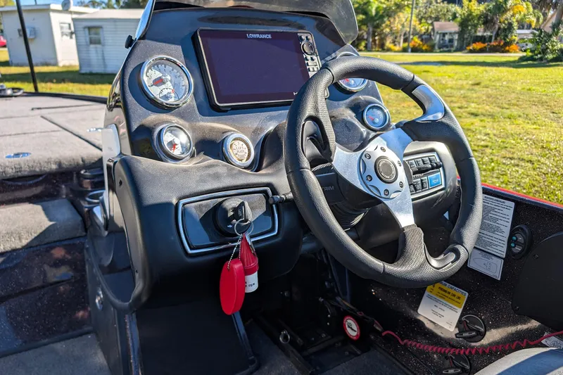 Slide: The Image of Steering console of a 2015 Nitro Z-9 boat with gauges and controls. - 10