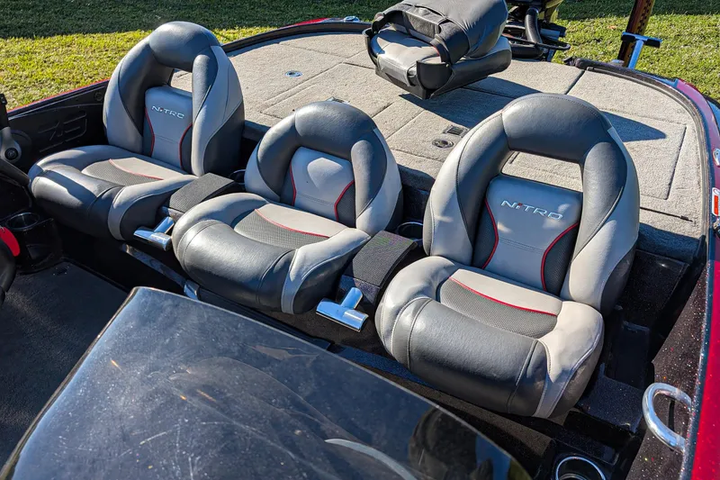 Slide: The Image of 2015 Nitro Z-9 boat interior with three cushioned seats and storage compartments. - 13