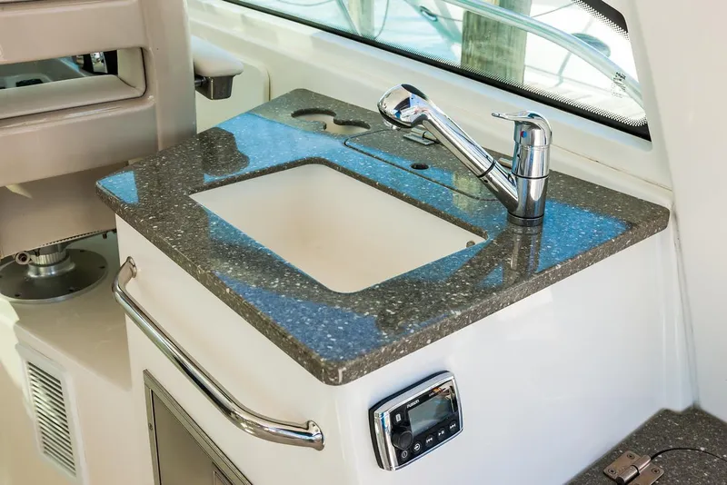 Slide: The Image of Manufacturer Provided Image: 2021 Boston Whaler 345 Conquest boat sink and countertop area. - 10