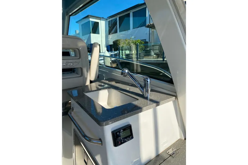 Slide: The Image of 2021 Boston Whaler 345 Conquest interior with sleek sink and modern faucet. - 18