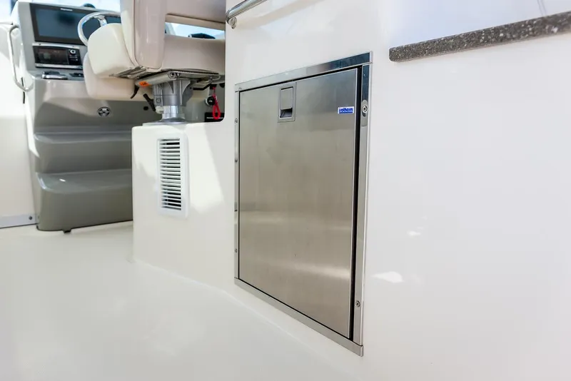 Slide: The Image of Manufacturer Provided Image: 2021 Boston Whaler 345 Conquest interior, featuring a stainless steel storage compartment. - 20