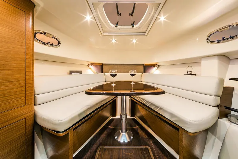 Slide: The Image of Manufacturer Provided Image: Luxurious interior of 2021 Boston Whaler 345 Conquest with elegant seating and dining area. - 28