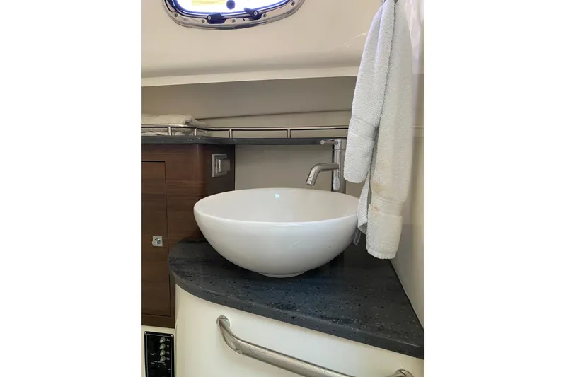 Slide: The Image of 2021 Boston Whaler 345 Conquest bathroom with modern sink and towel. - 29