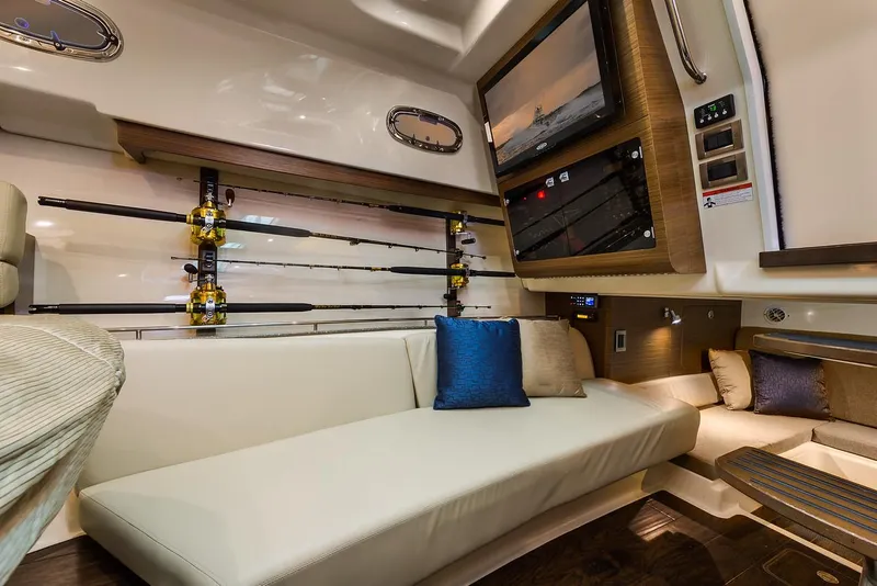 Slide: The Image of Manufacturer Provided Image: Interior of 2021 Boston Whaler 345 Conquest with fishing rods and comfortable seating. - 32