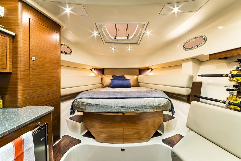 Slide: The Image of Manufacturer Provided Image: Luxurious cabin interior of 2021 Boston Whaler 345 Conquest with bed and seating area. - 33