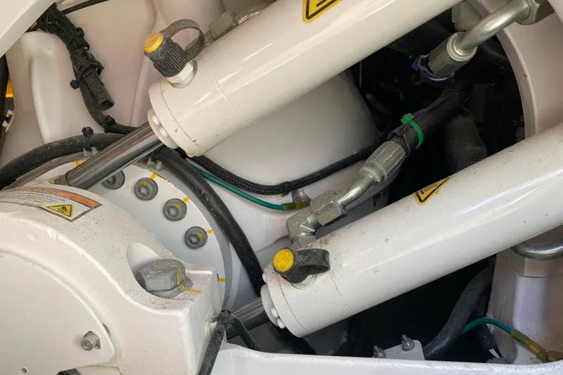 Slide: The Image of Close-up of hydraulic system components on a 2021 Boston Whaler 345 Conquest boat. - 35