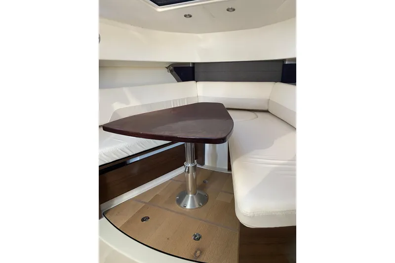 Slide: The Image of Interior of 2021 Boston Whaler 345 Conquest with elegant seating and wooden table. - 36